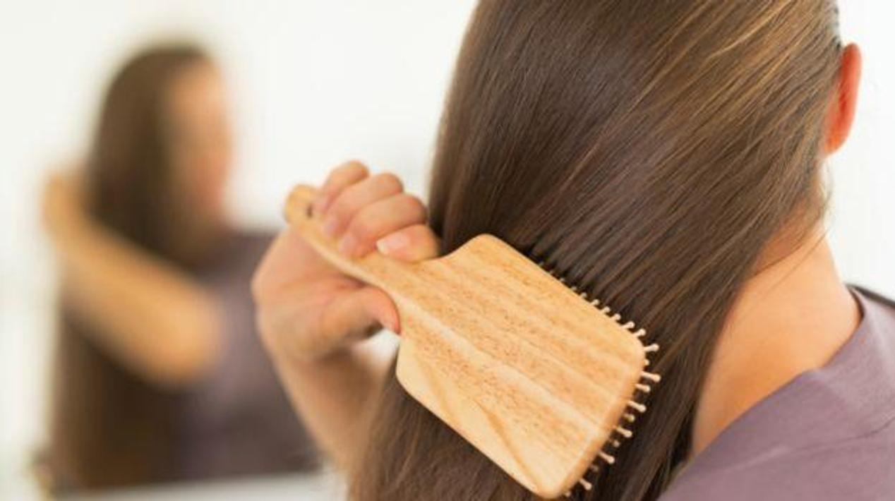 Combing the hair regularly