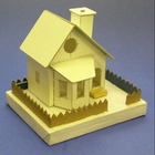 Conception miniature de maison en carton icône
